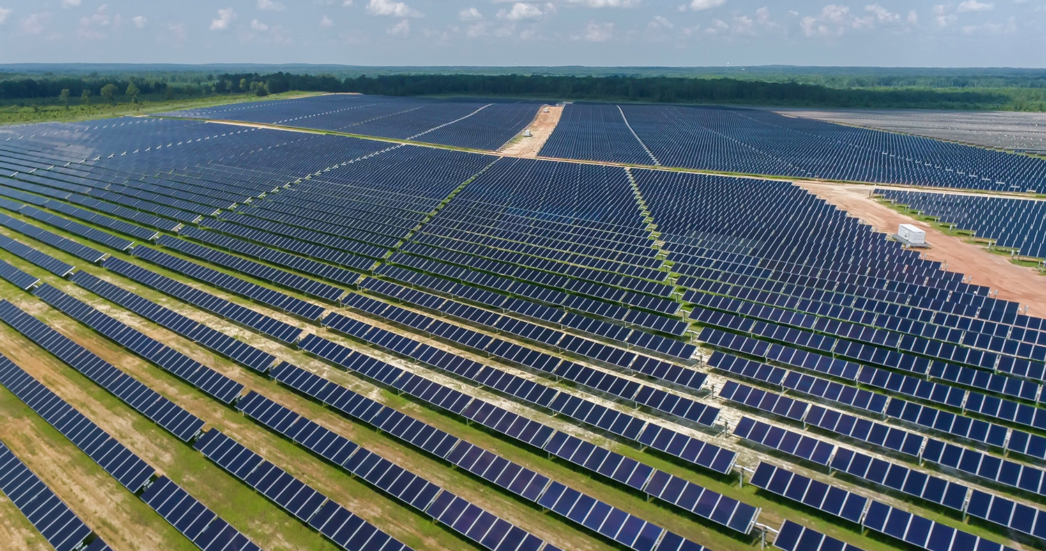 Expansive rows of solar panels at GA Solar 4, stretching across the horizon.