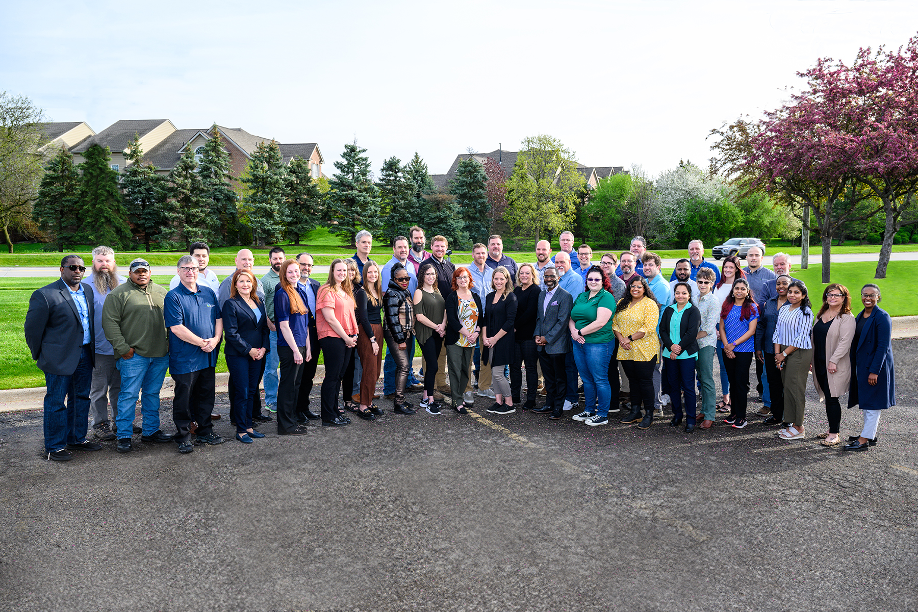 Group photo of MCA Team members outdoors.