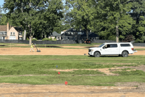 Subsurface investigation technician scanning ground with GPR.