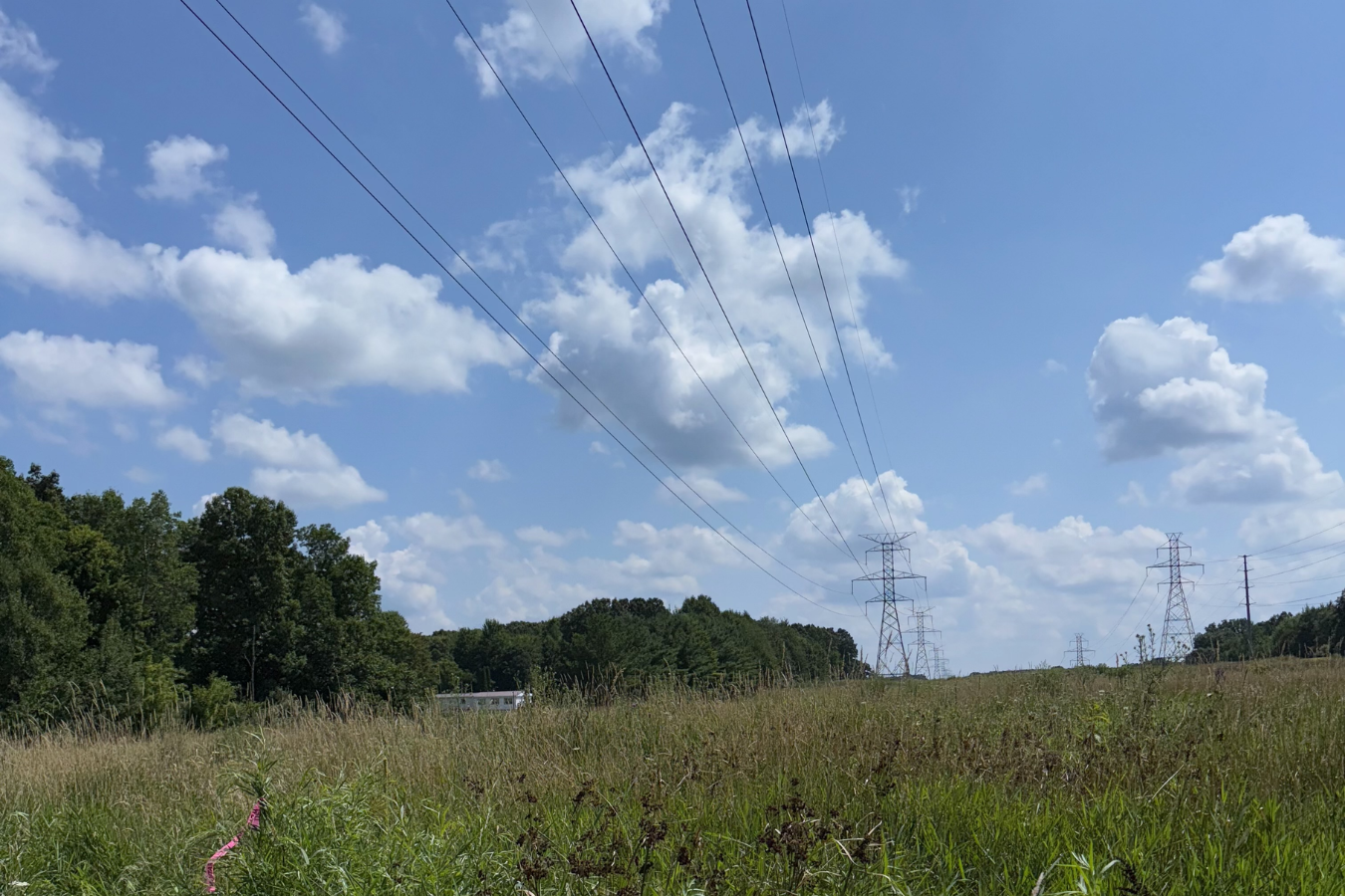 Transmission lines powered over future BESS development site.
